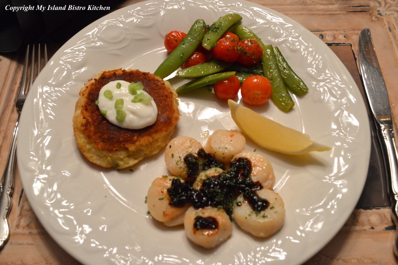 Scallops with Black Garlic Served with Potato Cake and Vegetables