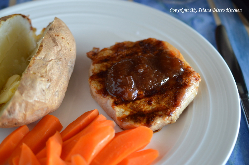 Grilled Pork Chop topped with Rhubarb Relish and Served with Baked PEI Potato and Buttered Carrots