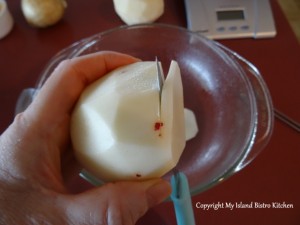 Slicing the red-eyed potato