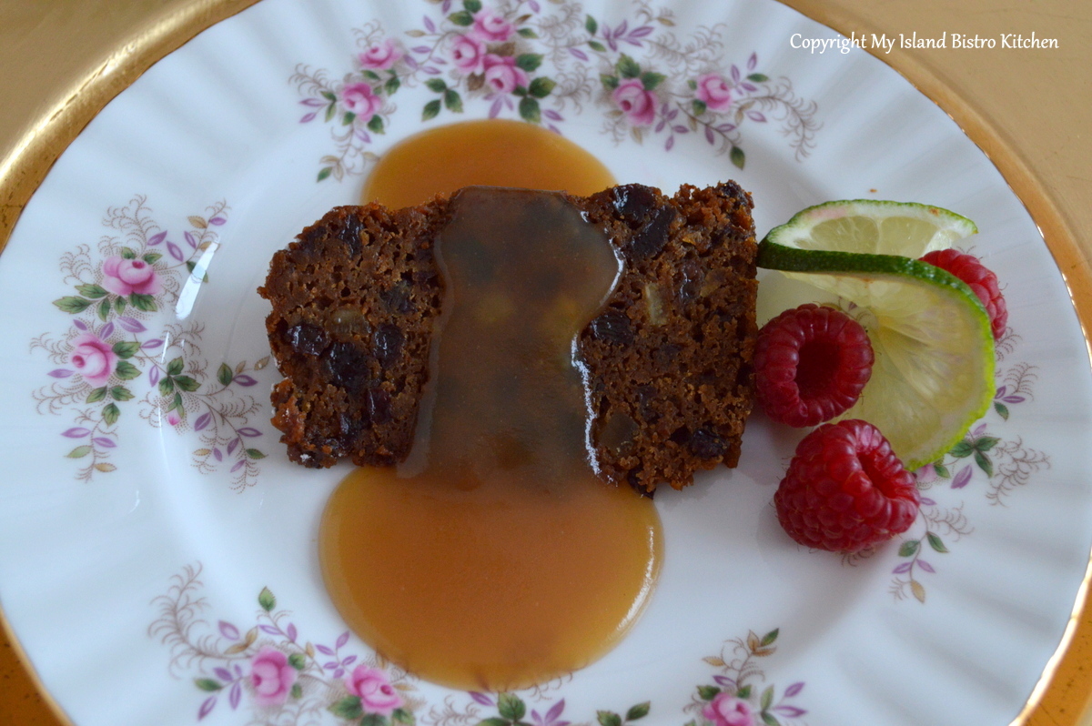 Plum Pudding Served with Buttered Rum Brown Sugar Sauce