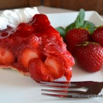 Slice of bright red strawberry pie