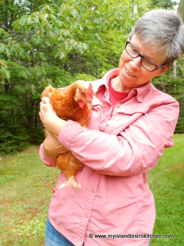 Shirley Gallant with one of her rented chickens from Barnyard Organics