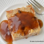 Top down view of Apple Maple Bread Pudding Covered in Maple Sauce