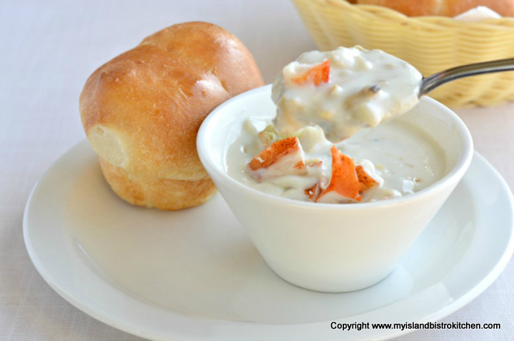 Bowl of seafood chowder and homemade roll at New Glasgow Lobster Suppers