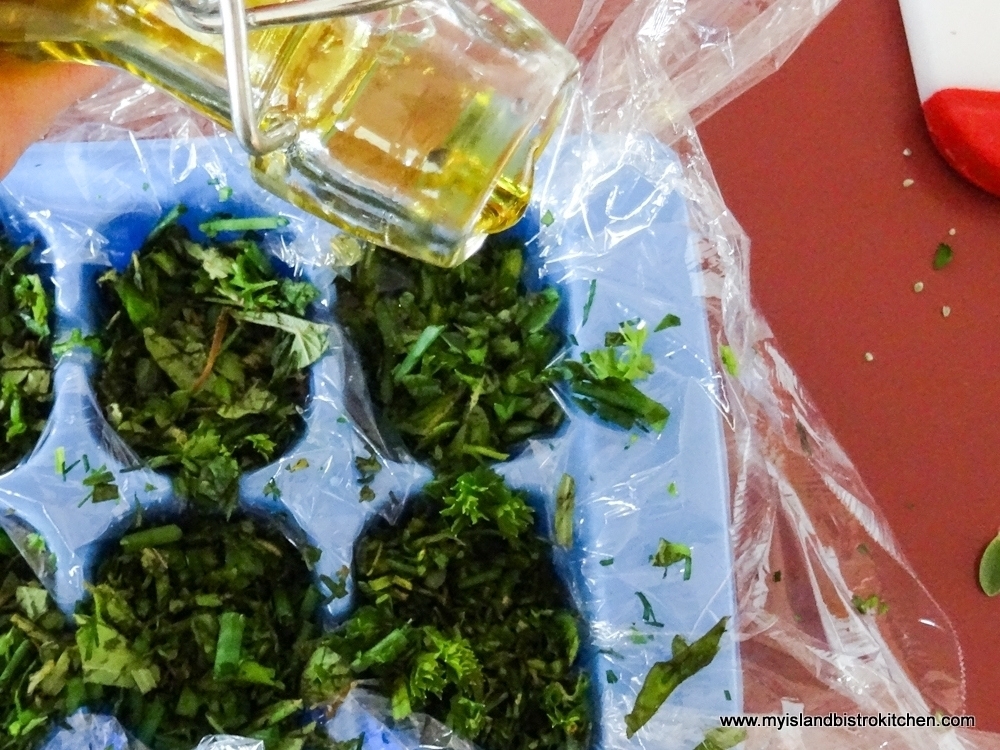 Pouring Olive Oil into Herb Cubes