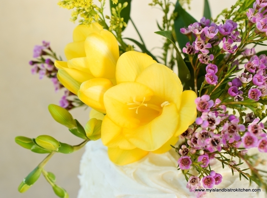 Yellow Freesia, Pink Wax Flowers, and Italian Ruscus Cake Topper for Lemon Elderberry Cake