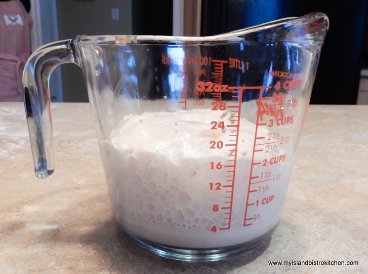 4-cup measuring cup with rising yeast inside