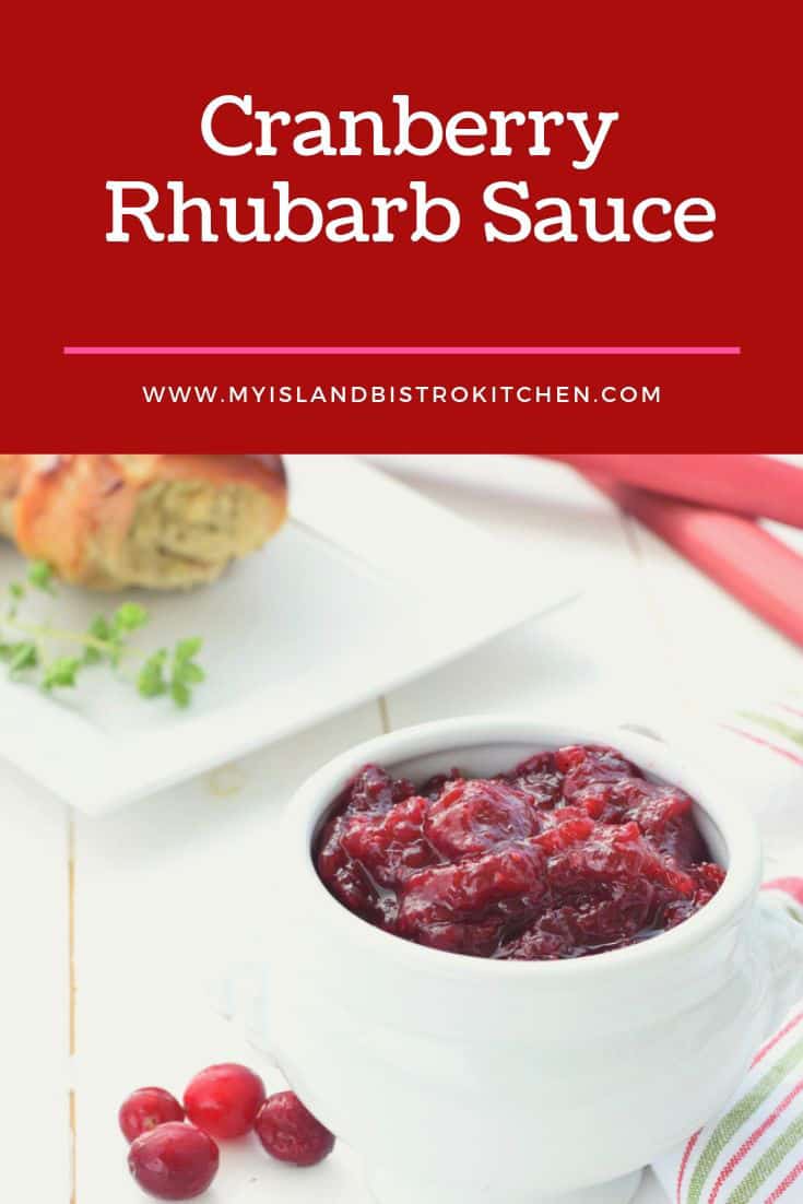 Bowl of Cranberry Rhubarb Sauce with Stuffed Rolled Turkey Breast in background
