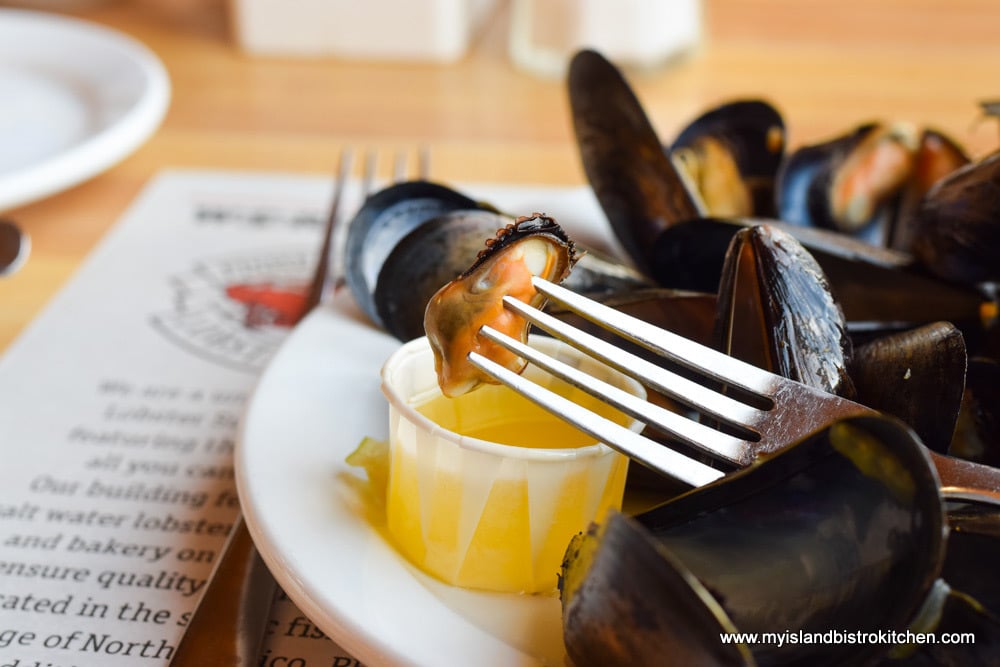 Steamed PEI mussels dipped in melted butter