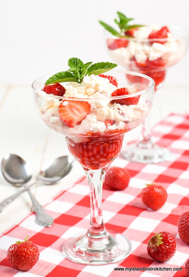 Two Eton Mess Desserts in glass pedestal dishes