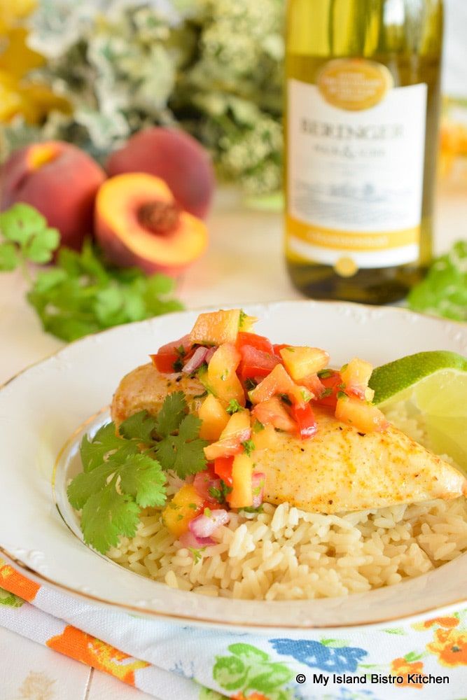 Peach Salsa tops roasted chicken breast served on a bed of steamed rice