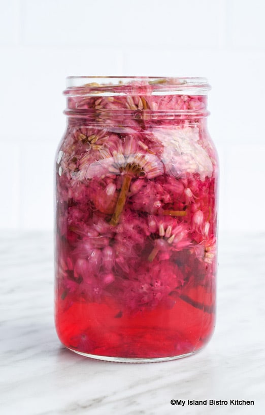 Mason Jar Filled with Chive Blossoms and Vinegar