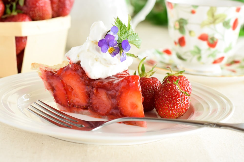 Slice of Strawberry Pie Topped with Whipped Cream