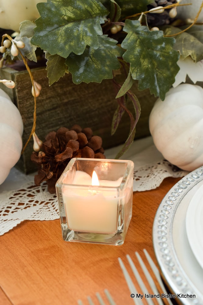 Votives add lovely glow from a low angle of a tablescape