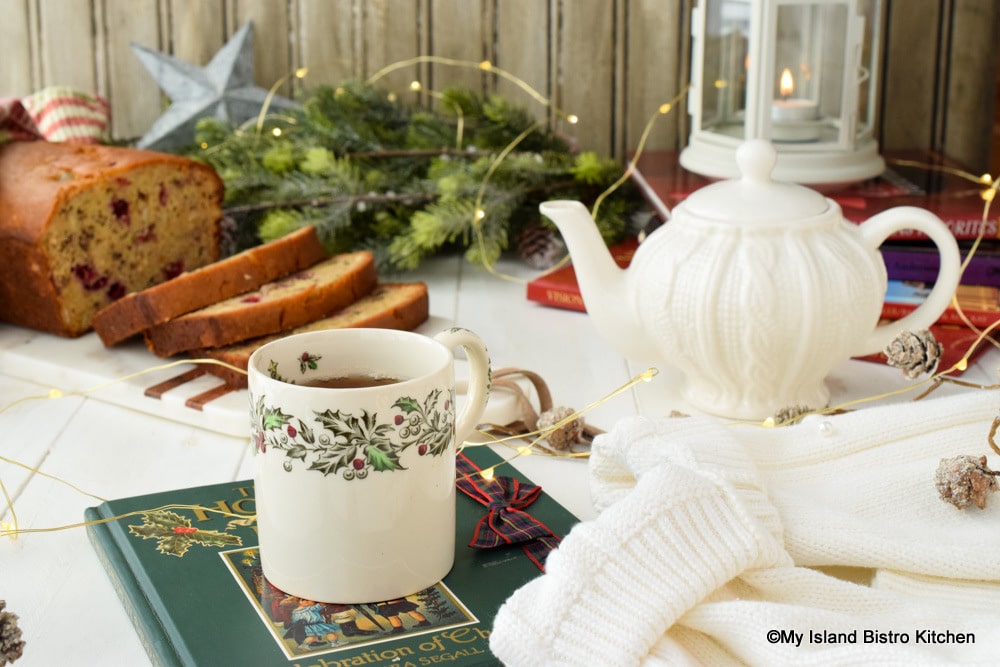 Antique Christmas Mug filled with tea to enjoy with Cranberry Orange Eggnog Loaf
