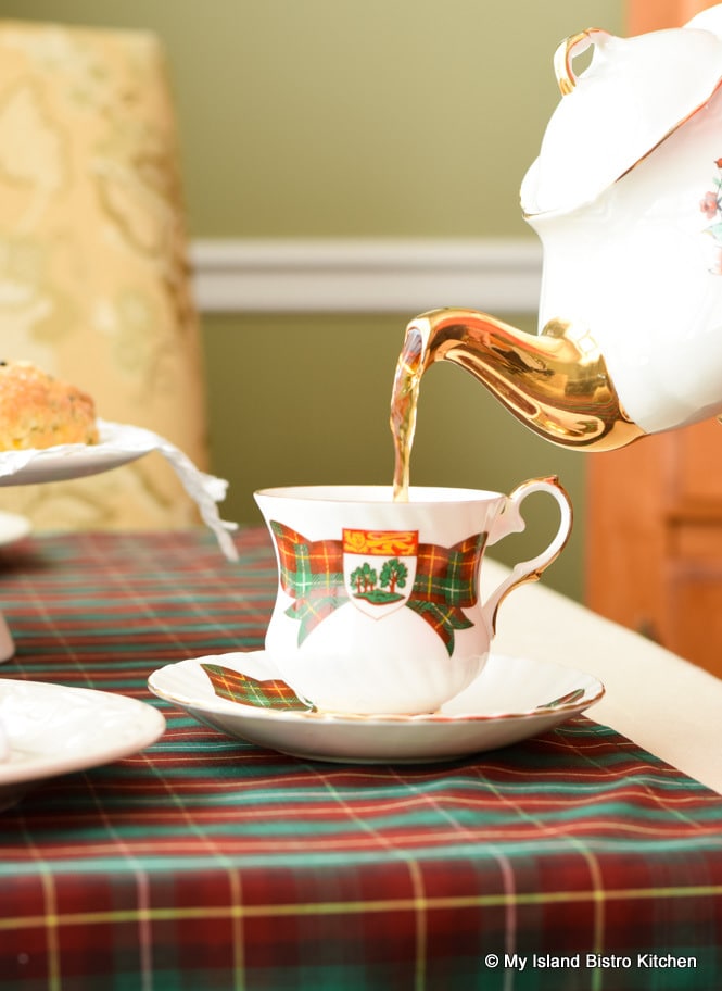 Tea being poured into an Elizabethan PEI Commemorative Teacup