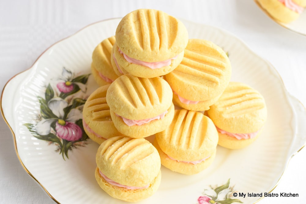 Stack of Custard Sandwich Cookies on Decorative Lady's Slipper Cake Plate
