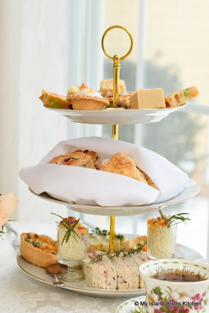 Tea server filled with afternoon tea fare
