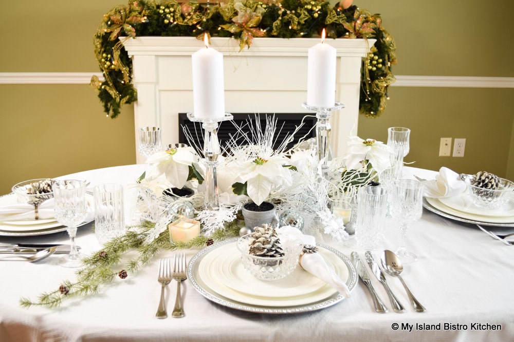 A white tablescape for Christmas dinner table