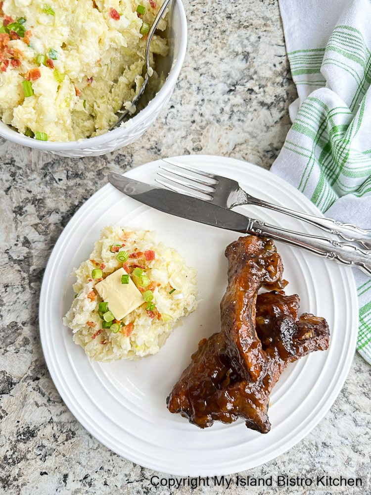 Plated meal of Colcannon Potatoes and Spareribs