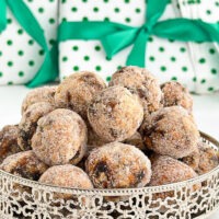 Round silver tray filled with date and nut balls