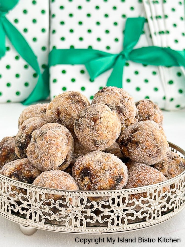 Round silver tray filled with date and nut balls