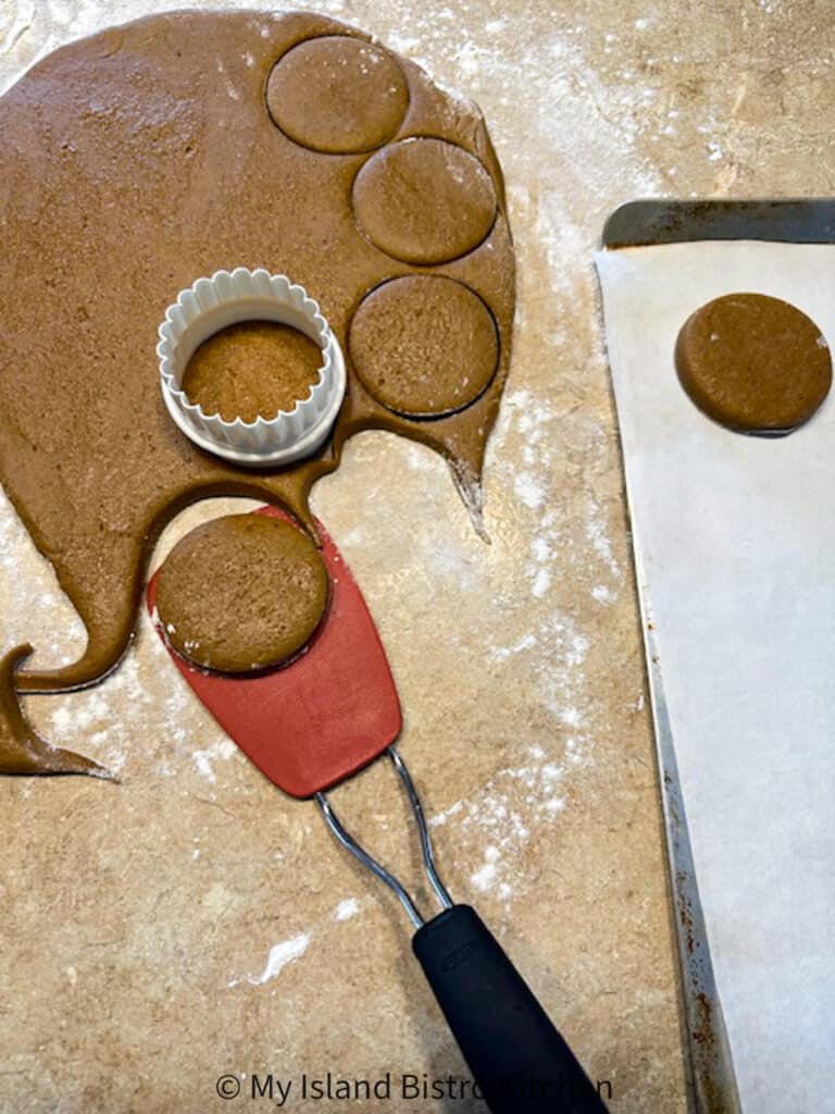 Cut out Molasses Cookies on counter ready to be transferred to baking sheet