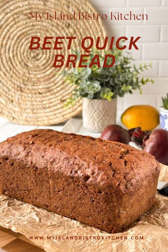 A no-yeast bread sits on parchment paper with beets in background