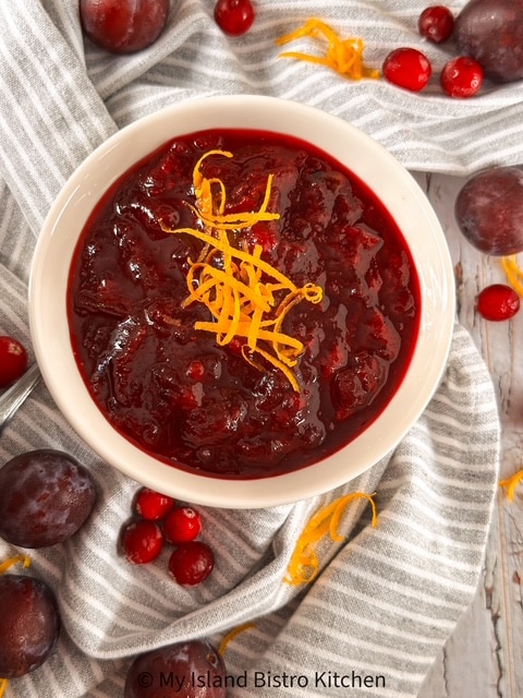 A bowl filled with sauce made with cranberries